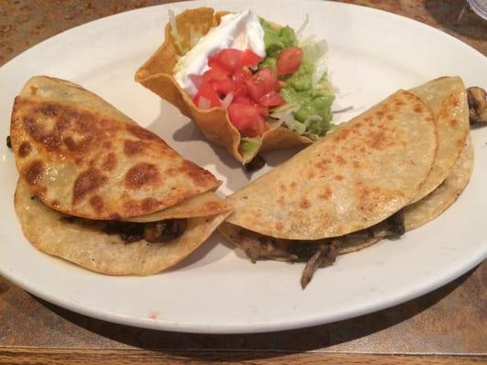 Mushroom quesadillas with a guacamole salad. Nice presentation.