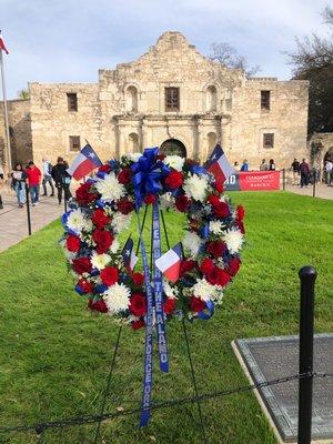 Red, white, and blue wreath requested by TITFF for the 2023 anniversary of the Battle of the Alamo.