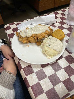 Chicken fried steak, mashed potatoes and hot water cornbread