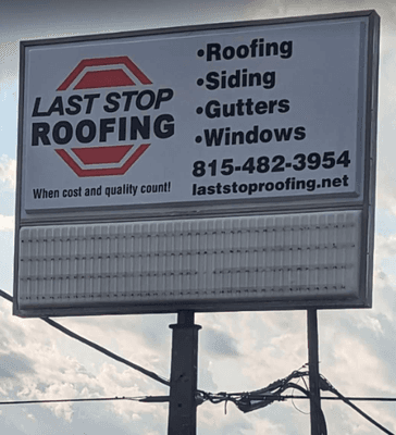 Last stop roofing street sign