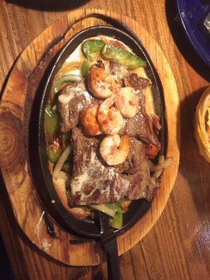 Steak and shrimp fajitas dinner plate