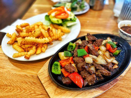 Stir Fried Cubed Beef Filet Mignon with a side of fries and a salad. : )