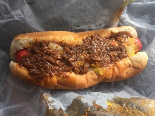 Here you have a $1 Southern style Chili Dog - neon red wiener, steamed bun, & solid chili!