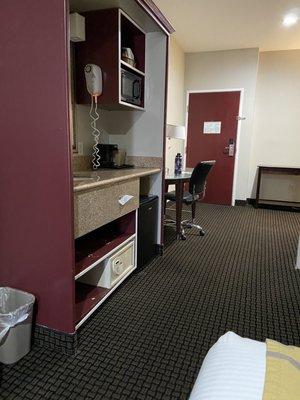 Looking toward door and empty tv stand