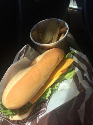 Chicken hoagie and some potato wedges.