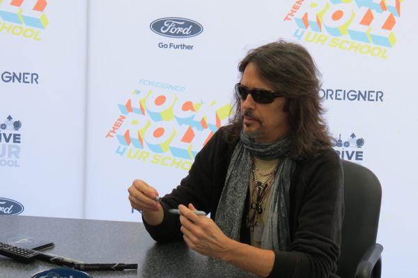 Foreigner lead singer signing autographs at the dealership