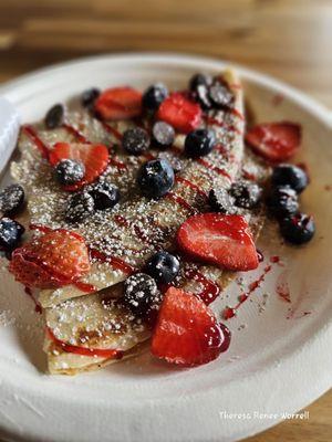 Crepe with strawberries, chocolate chips, and blueberries @ $9.00