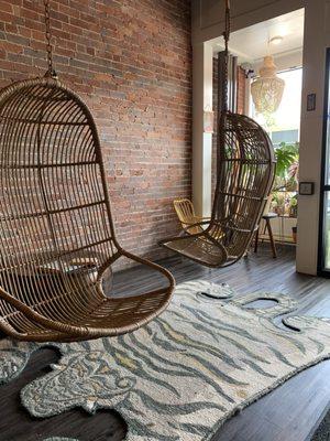 Gorgeous rattan swings on your right as you enter.