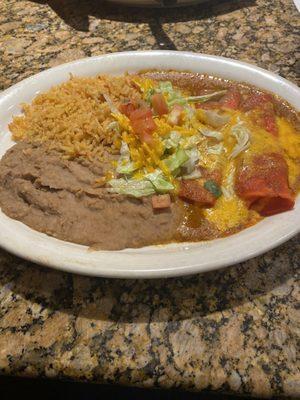 Enchilada plate. Two enchiladas, rice, refried beans and small salad.