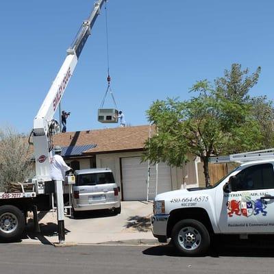 Crane install of a new HVAC system