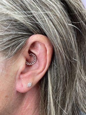 Left-ear daith and second ear lobe piercing. Jewelry purchased at location.