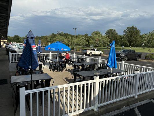 The patio has lots of outdoor seating, for both small and large groups.