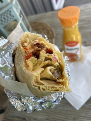 Three egg breakfast burrito with sausage and bacon