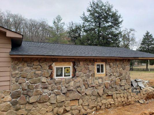 The real back of the house. Windows put in. No footers exposed. No house leaning.