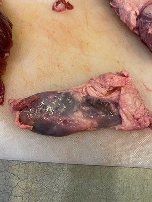 Disgusting tumor and fat. This was in one of the supposedly vacuum sealed bag.  Why would you bag this?