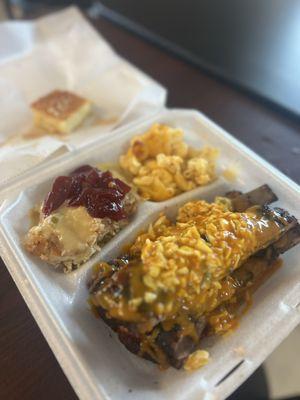 Ribs with slaw and sauce, chicken stuffing with gravy and cranberry sauce, Mac and Cheese, corn bread