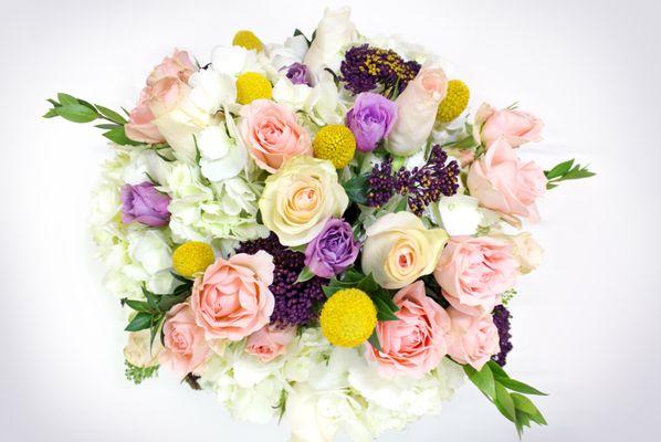 Flowers: Light Pink Roses, Light Pink And Purple Spray Roses, White Hydrangeas Greens: Myrtle