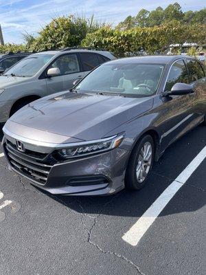 The valet driving my Lexus hit this Honda Accord park next to me.
 See damage!