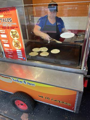 The lady that would make the street tacos to order. Hot and fresh.