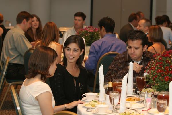 Learning good conversation skills around the dining table is important for future career success