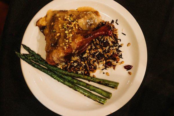 Cornish Hen with wild rice pilaf and asparagus.