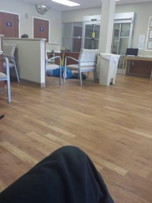 Laying on a dirty hospital floor in ER waiting room. Why would they allow this?