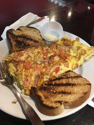 Four egg omelette with turkey bacon cheddar tomato