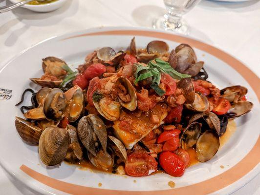 Squid ink linguini with clams, calamari and halibut