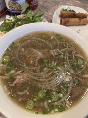 Filet mignon pho with egg rolls