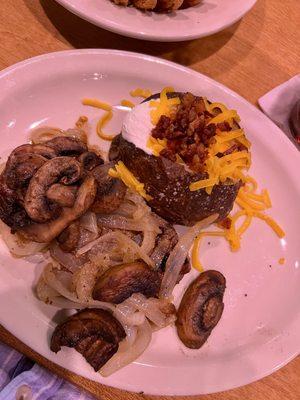 6oz tenderloin with mushrooms and onion loaded baked potato on the side.