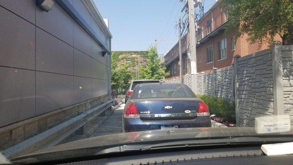 Long line for a car wash.  This would be ok, if efficient...but super slow