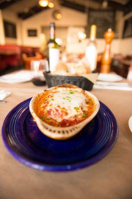 Our homemade lasagna. Traditional style with layers of ricotta, mozzarella, marinara and our seasoned ground beef. It's to die for!