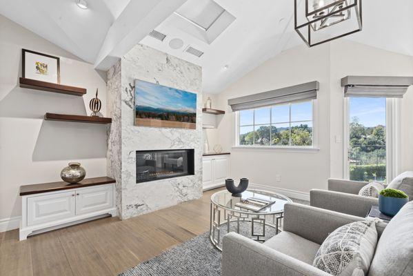 This beautifully staged living area captured the essence of modern elegance, helping to turn a house into someone's dream home.