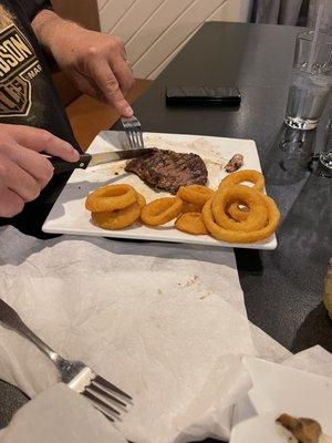 Delmonico steak with onion rings