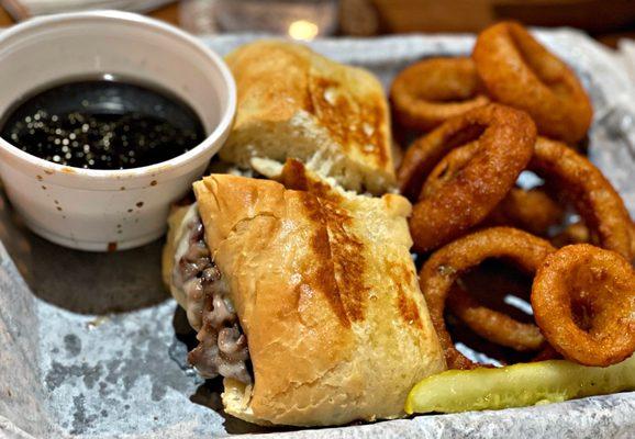 French dip with au jus. Served with onion rings.