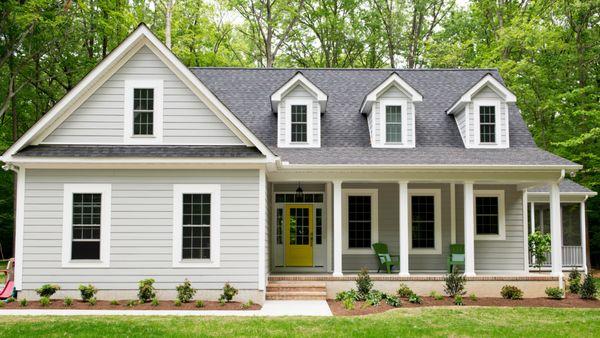 Love this home with it's front porch and yellow door!