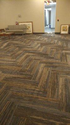 Chevron-patterned carpet-tiles in Commercial Reception area