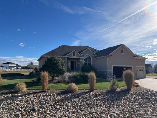 A pristine roof enhances this home's grand exterior, ensuring weather resilience and a polished look for years to come.