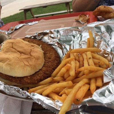 Tenderloin sandwich w fries.