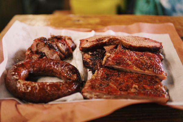 Pork Shoulder Steak, Jalapeño Sausage, Ribs, Brisket (counterclockwise)