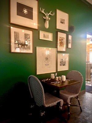 Eclecticism resounds within these walls as this Emerald paint & vintage photos encapsulate the wonder & excitement...