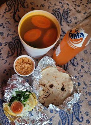 Caldo de pollo (chicken soup) with rice, three handmade tortillas, and condiments. Delicious.