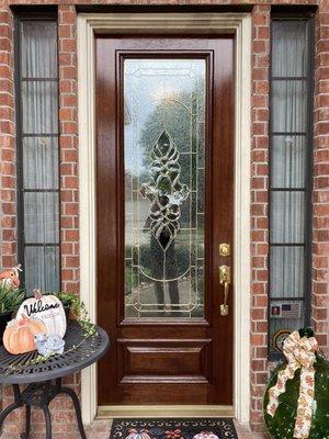 8 foot door (after) picture stained Provincial in color with gloss polyurethane finish Cypress, Texas.