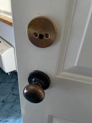 The broken deadbolt on our balcony door.