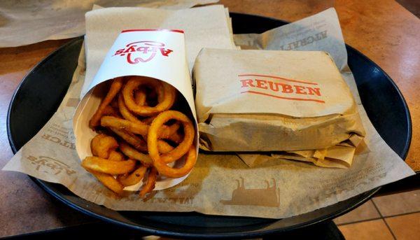 Reuben sandwich and curly fries.