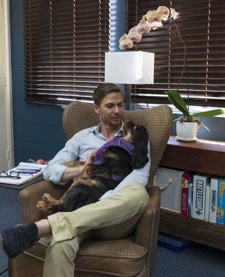 Dr. R. Austin Heafey and his therapy dog Sammy at his Montclair Oakland Office.