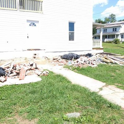 Stone, Concrete. Brick. Wood. on side of house. Heavy Jobs. no prob