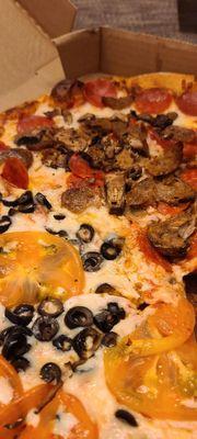 Round Neapolitan Pizza 1/2 B Olives & tomato 1/2 pepperoni, sausage and mushroom