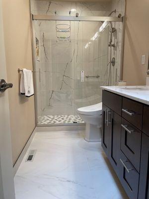 bathroom remodeling with bidet toilet , double sink vanity with espresso shaker cabinetry & quartz countertop