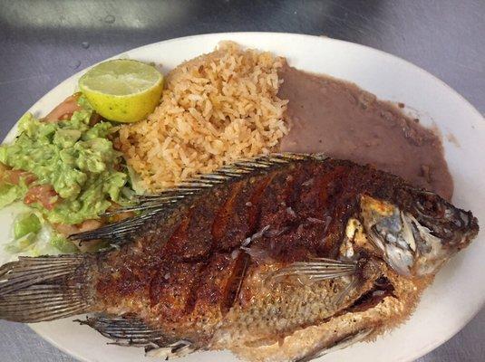 Plate #18- Plato de Mojarra/ Fish Plate. Side order of lettuce, tomato, guacamole, rice and beans